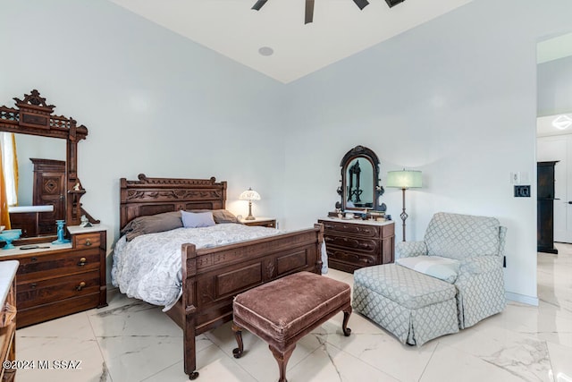 bedroom featuring ceiling fan and high vaulted ceiling