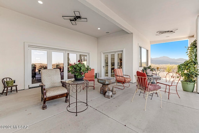 view of patio with french doors and a mountain view