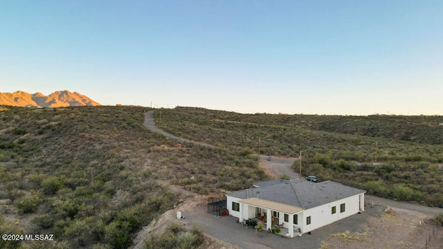 birds eye view of property with a mountain view