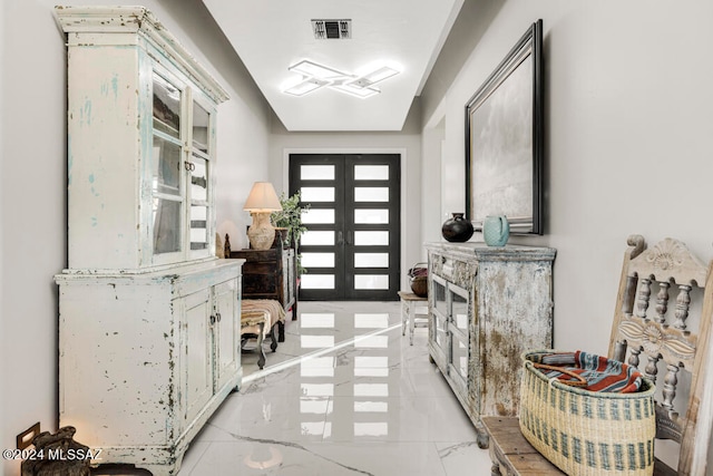 foyer entrance featuring french doors