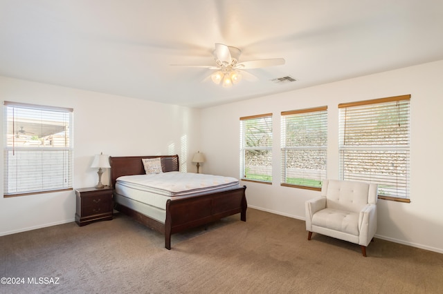 bedroom with multiple windows, carpet flooring, and ceiling fan