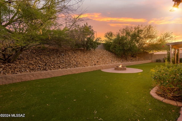 view of property's community featuring a patio and a lawn