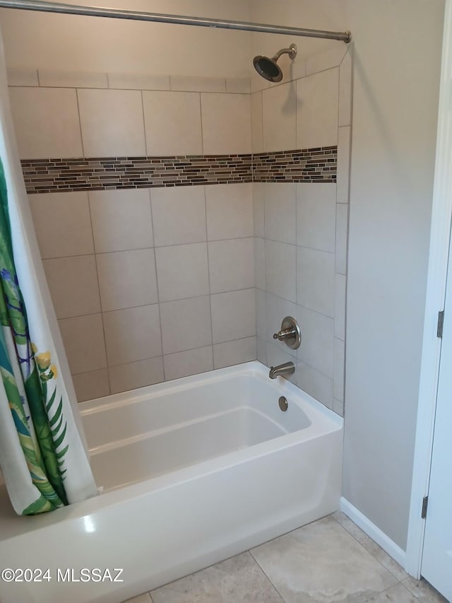 bathroom with tile patterned floors and shower / bathtub combination with curtain