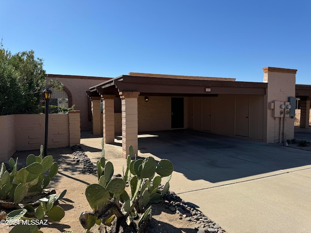 rear view of property with a carport