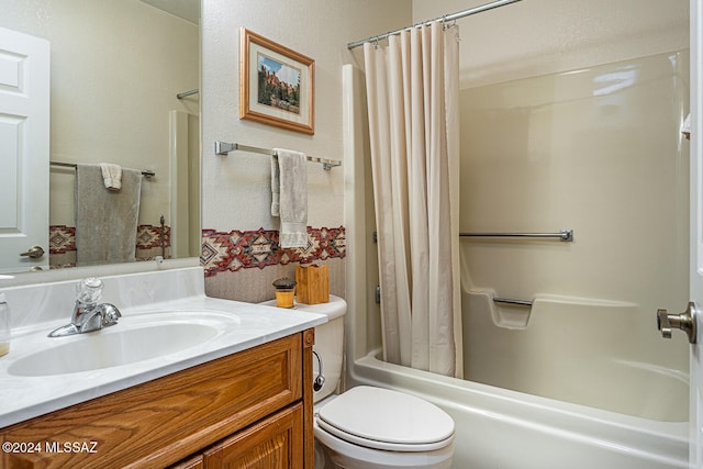 full bathroom with vanity, toilet, and shower / bath combo with shower curtain