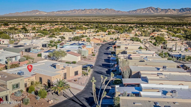 birds eye view of property with a mountain view