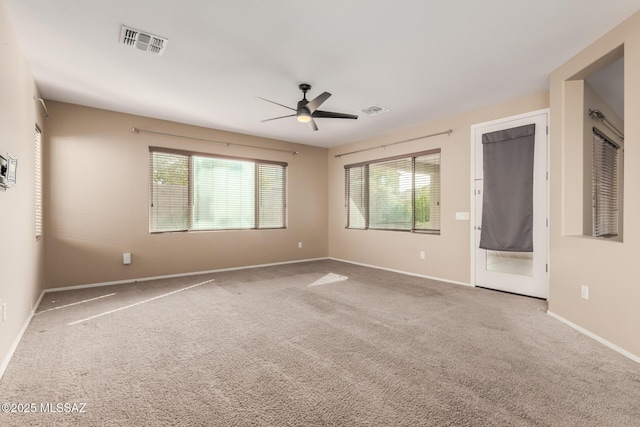 8869 W Irongate Rd, Marana, AZ 85653 - carpeted spare room featuring ceiling fan, healthy amount of natural light, and baseboards