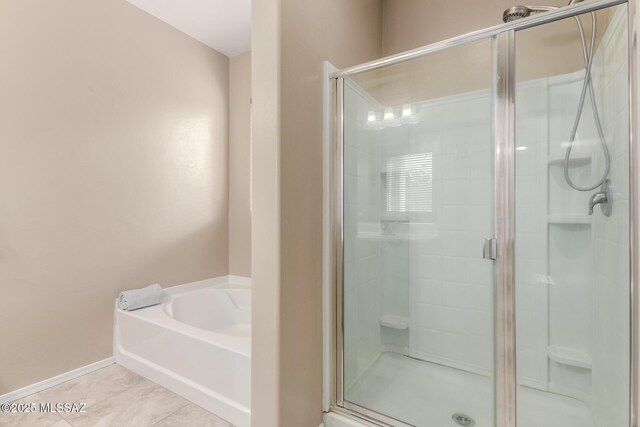 bathroom featuring separate shower and tub and tile patterned flooring