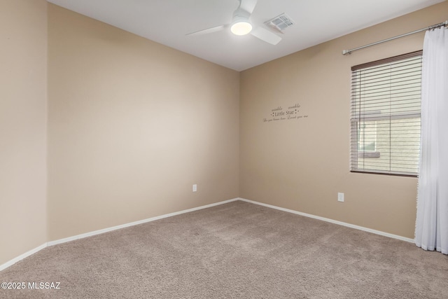 unfurnished room with ceiling fan and carpet flooring