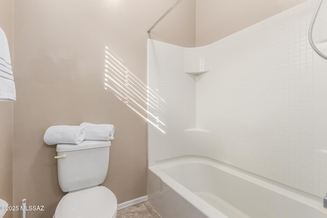 8869 W Irongate Rd, Marana, AZ 85653 - bathroom with toilet, shower / bathtub combination, and baseboards