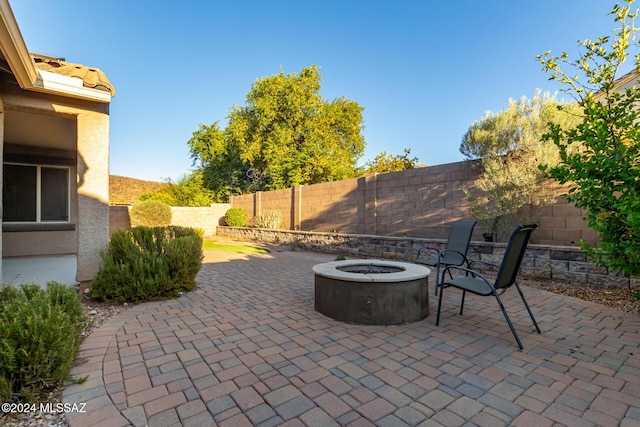 view of patio / terrace with a fire pit