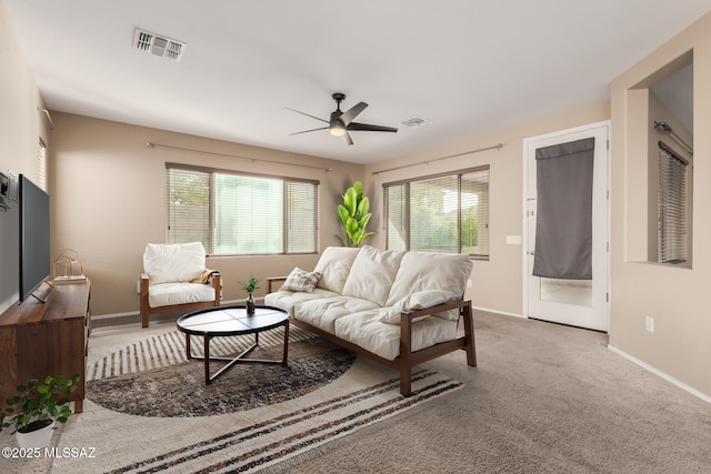 8869 W Irongate Rd, Marana, AZ 85653 - carpeted living area with a ceiling fan, healthy amount of natural light, and baseboards