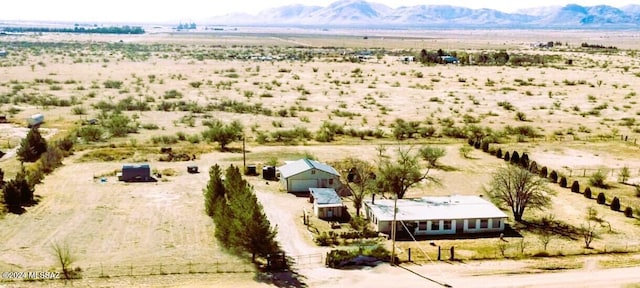 drone / aerial view featuring a rural view and a mountain view