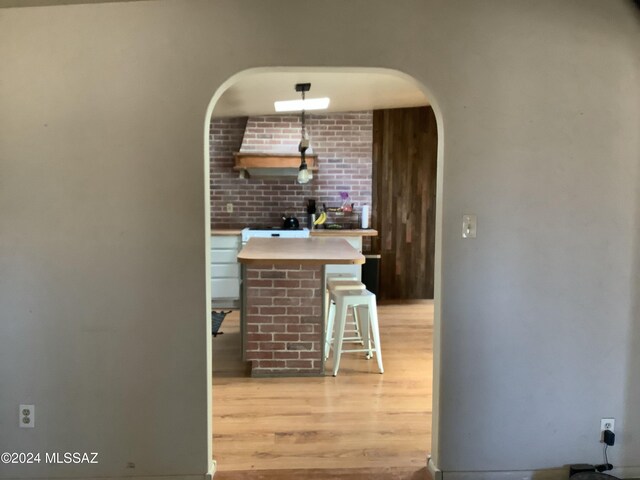 bar featuring light wood-type flooring