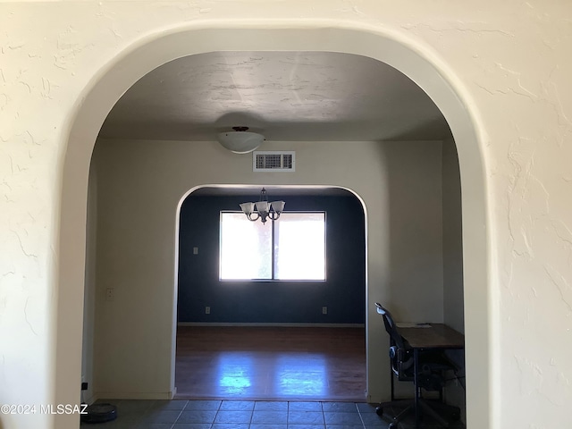 7857 W Winchester Easement, Willcox, AZ 85643 - interior space featuring a chandelier, visible vents, arched walkways, and tile patterned flooring
