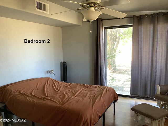 bedroom featuring light wood-type flooring and ceiling fan