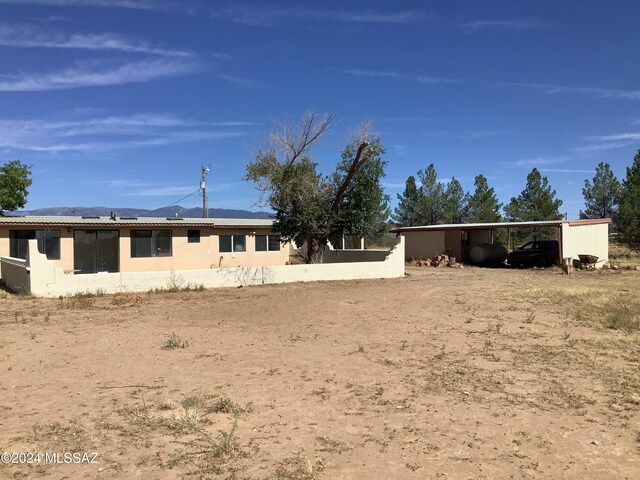 exterior space with a carport