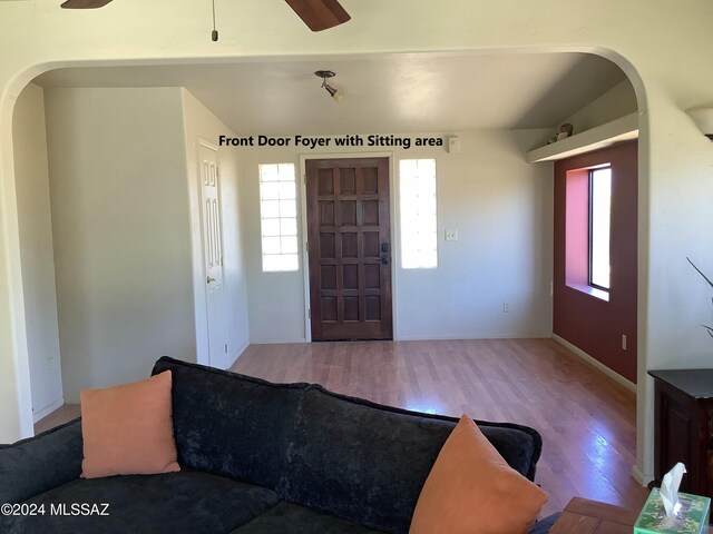 foyer with light hardwood / wood-style flooring and ceiling fan