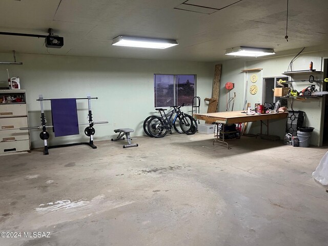 7857 W Winchester Easement, Willcox, AZ 85643 - garage with a garage door opener and a workshop area