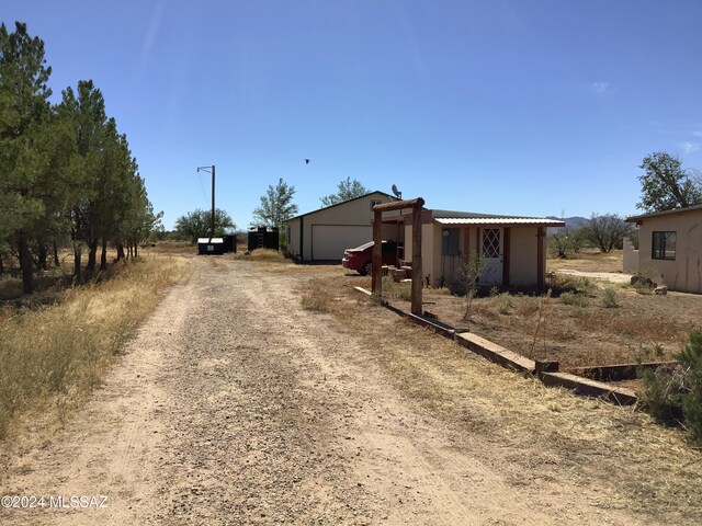 exterior space with an outdoor structure and a garage