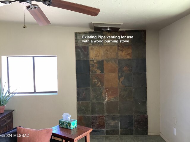 interior space featuring ceiling fan