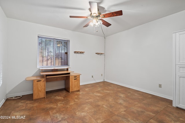 unfurnished office with ceiling fan