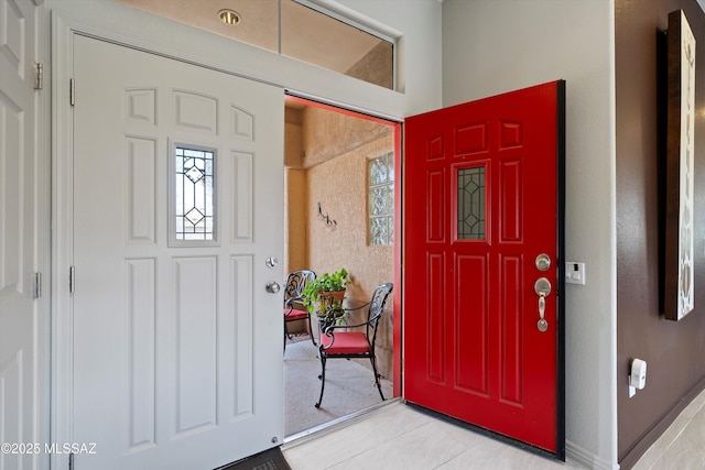 entrance foyer featuring light tile patterned floors