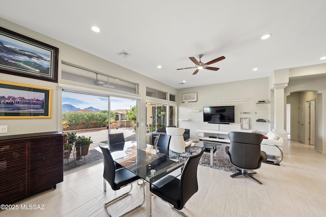 dining space with visible vents, arched walkways, ceiling fan, ornate columns, and recessed lighting