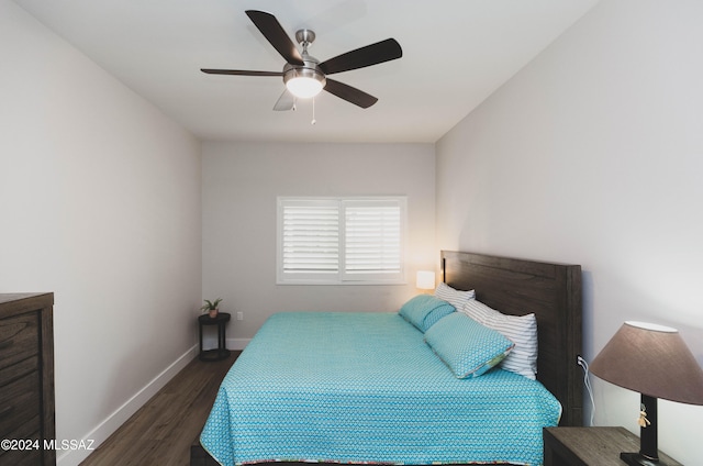 bedroom with ceiling fan and dark wood-type flooring