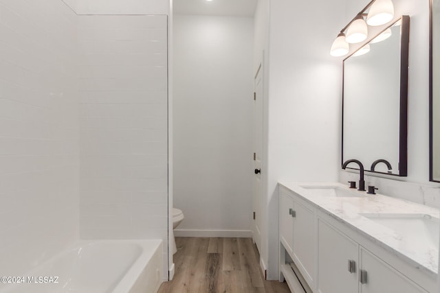 bathroom with vanity, hardwood / wood-style floors, and toilet