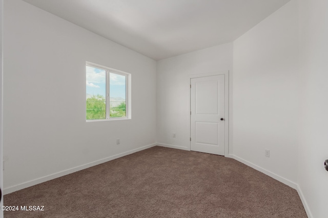 spare room featuring carpet flooring