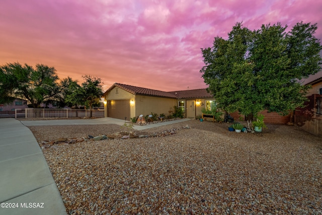 view of front of property with a garage