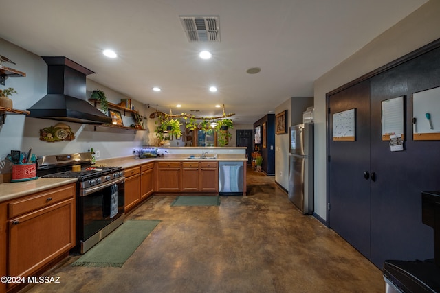 kitchen featuring kitchen peninsula, appliances with stainless steel finishes, extractor fan, and sink