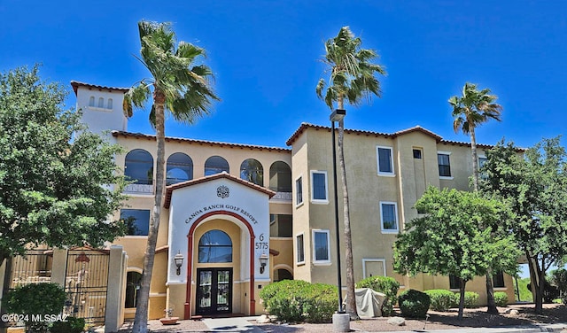 exterior space featuring french doors and stucco siding