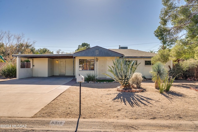 ranch-style home with a carport