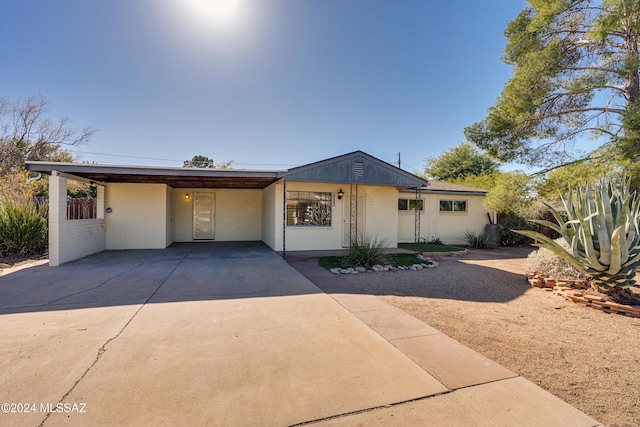 view of front of home with a carport