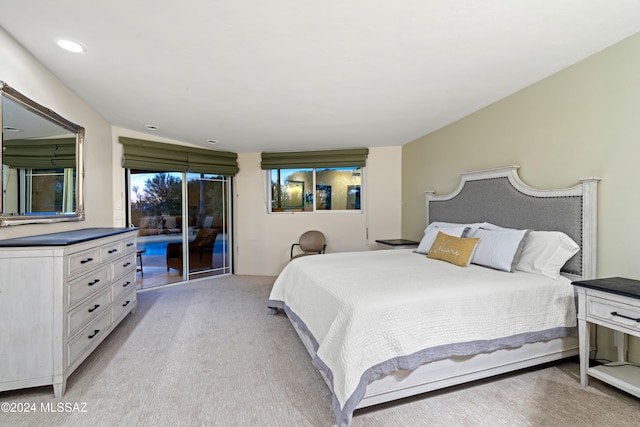 carpeted bedroom featuring access to outside