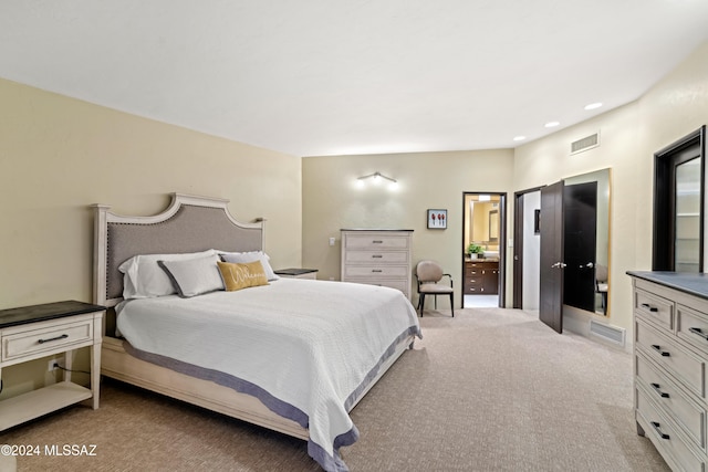 bedroom with light colored carpet