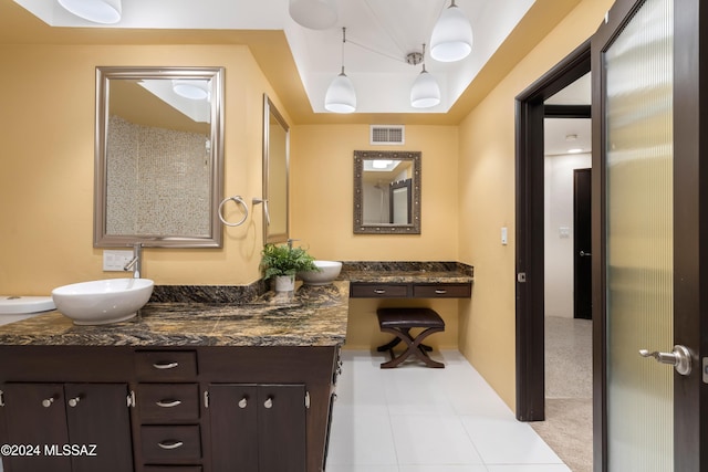 4750 N Calle Desecada, Tucson, AZ 85718 - bathroom with vanity, tile patterned floors, baseboards, and a tray ceiling
