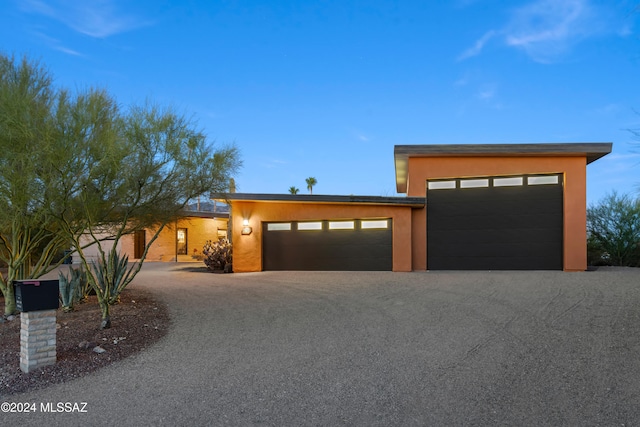 view of front of property with a garage