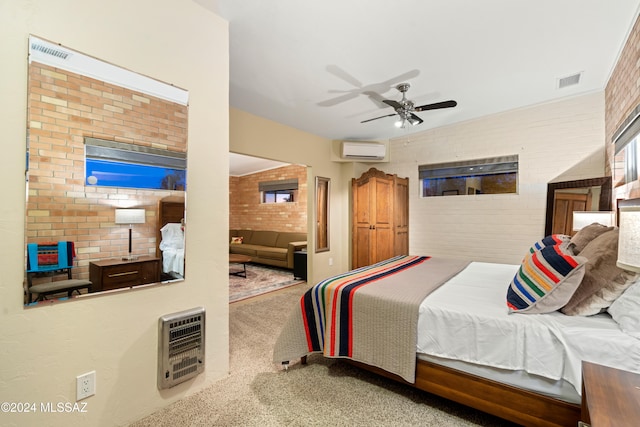 bedroom featuring carpet flooring, ceiling fan, a wall mounted air conditioner, brick wall, and heating unit