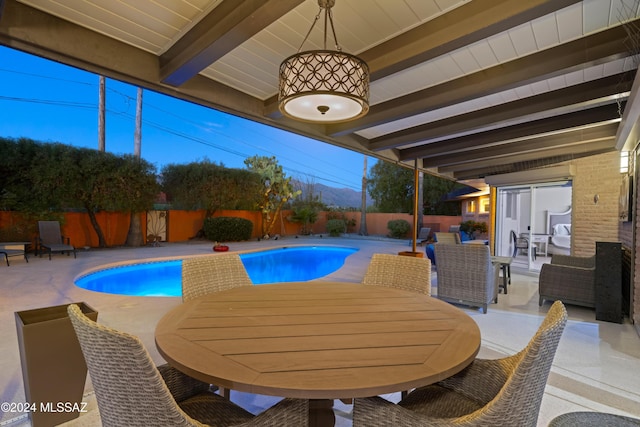 4750 N Calle Desecada, Tucson, AZ 85718 - view of swimming pool with outdoor dining space, a fenced backyard, and a patio area
