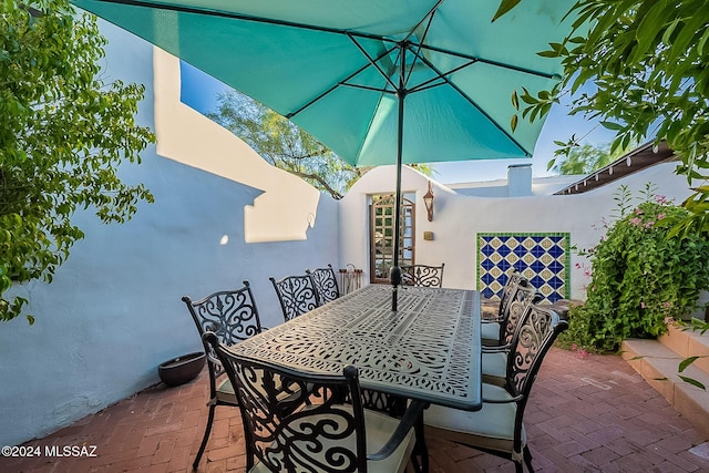 view of patio featuring outdoor dining area