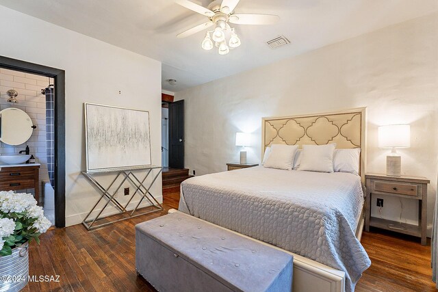 bedroom featuring a sink, a ceiling fan, hardwood / wood-style floors, and visible vents