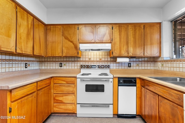 kitchen featuring decorative backsplash and white electric range