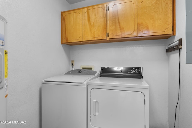 laundry area featuring cabinets and washer and clothes dryer