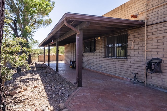 view of patio / terrace featuring a carport