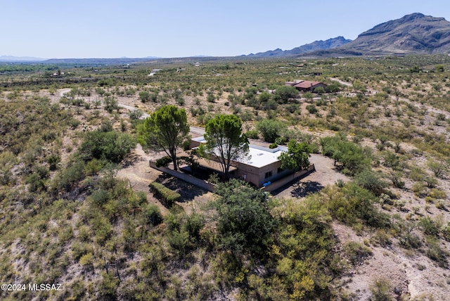 birds eye view of property featuring a mountain view