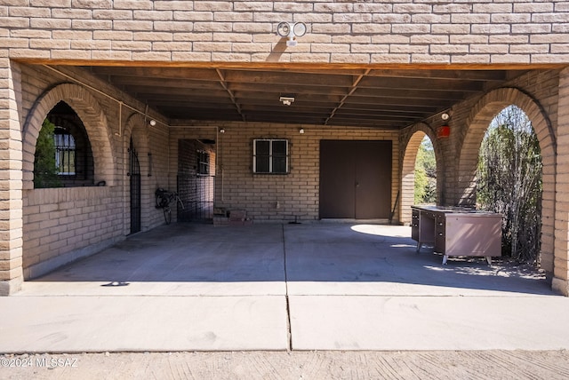 view of patio / terrace featuring a carport