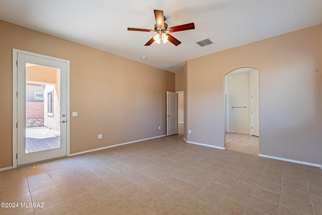 spare room featuring ceiling fan and light tile patterned floors